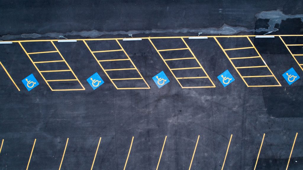 Parking lot with clearly striped accessible stalls — example of ADA parking lot striping compliance