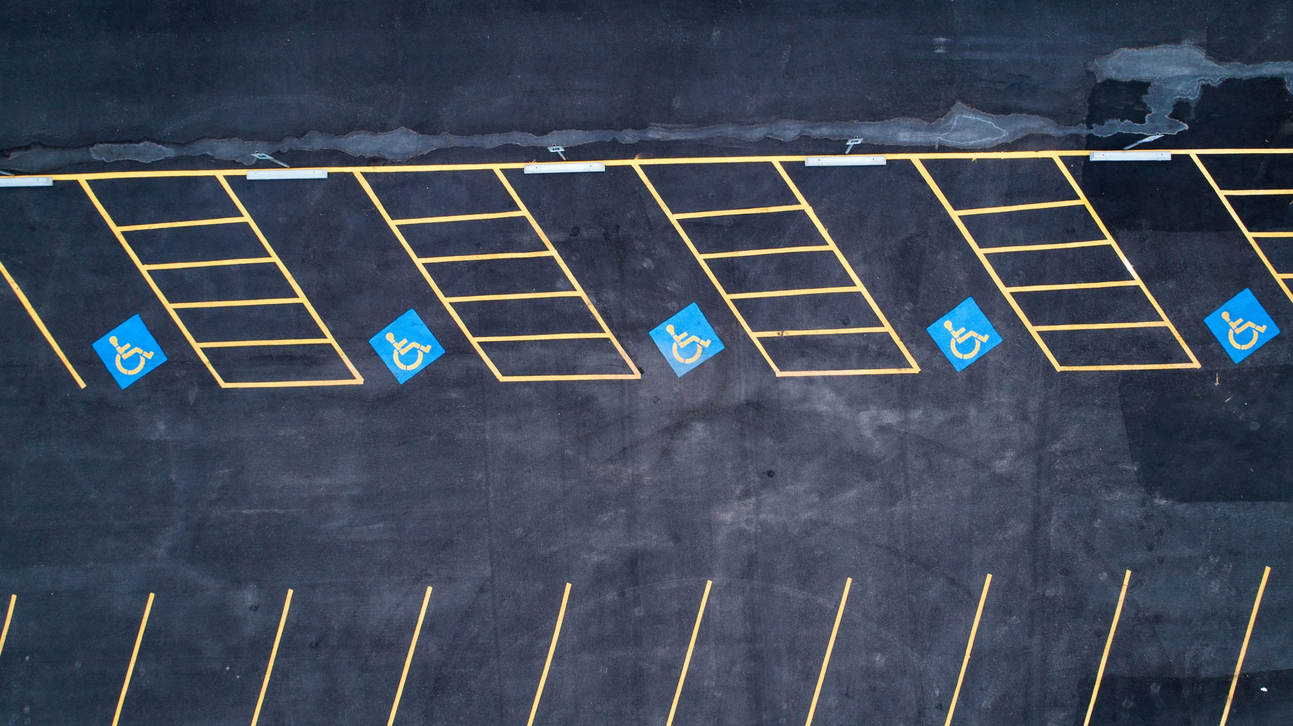 Parking lot with clearly striped accessible stalls — example of ADA parking lot striping compliance