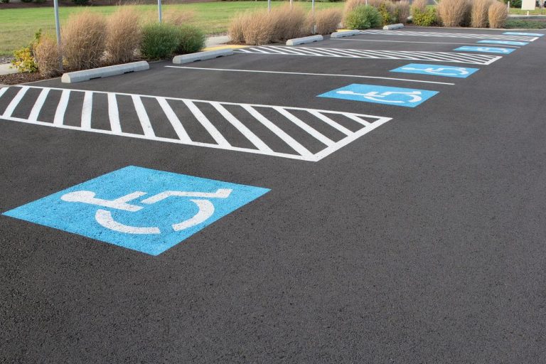 Parking lot with clearly striped accessible stalls — example of ADA parking lot striping compliance