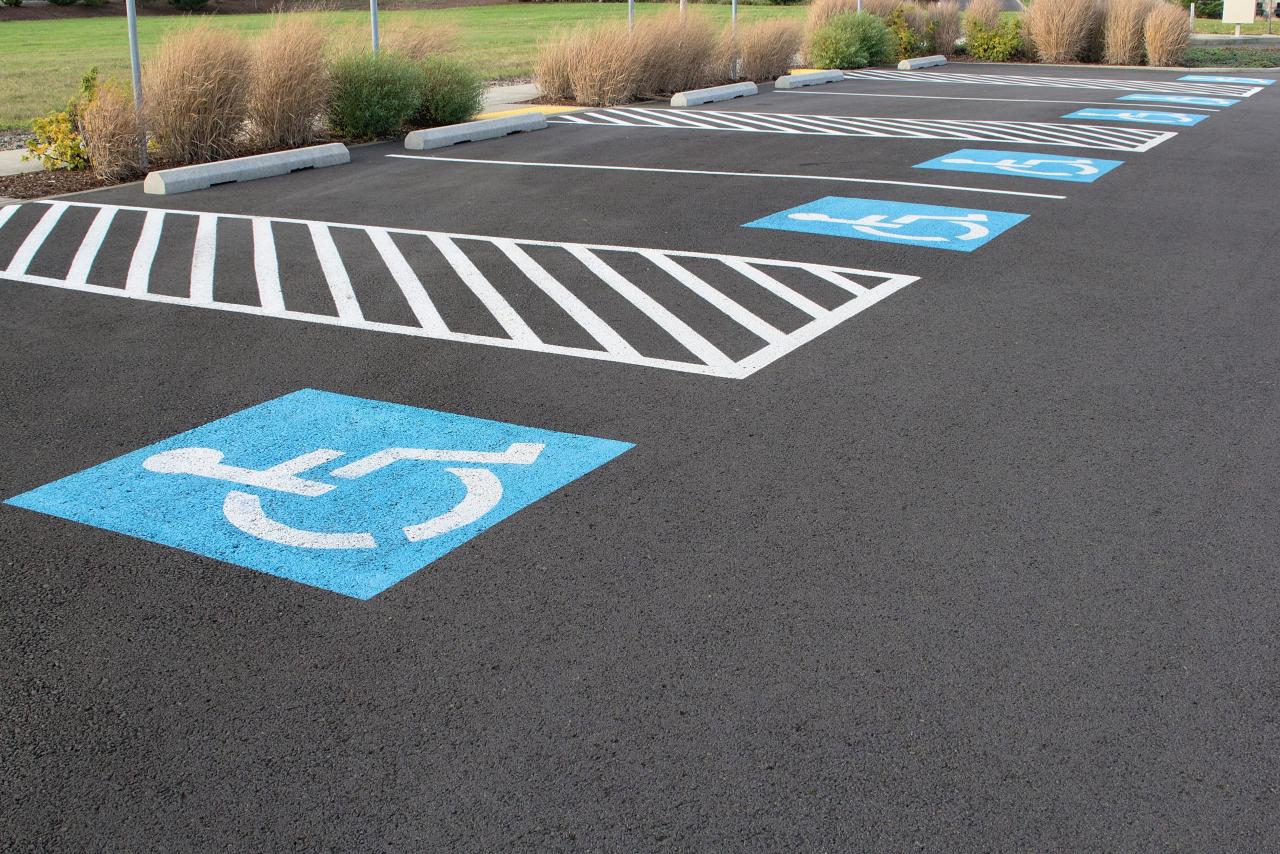 Parking lot with clearly striped accessible stalls — example of ada parking lot striping compliance